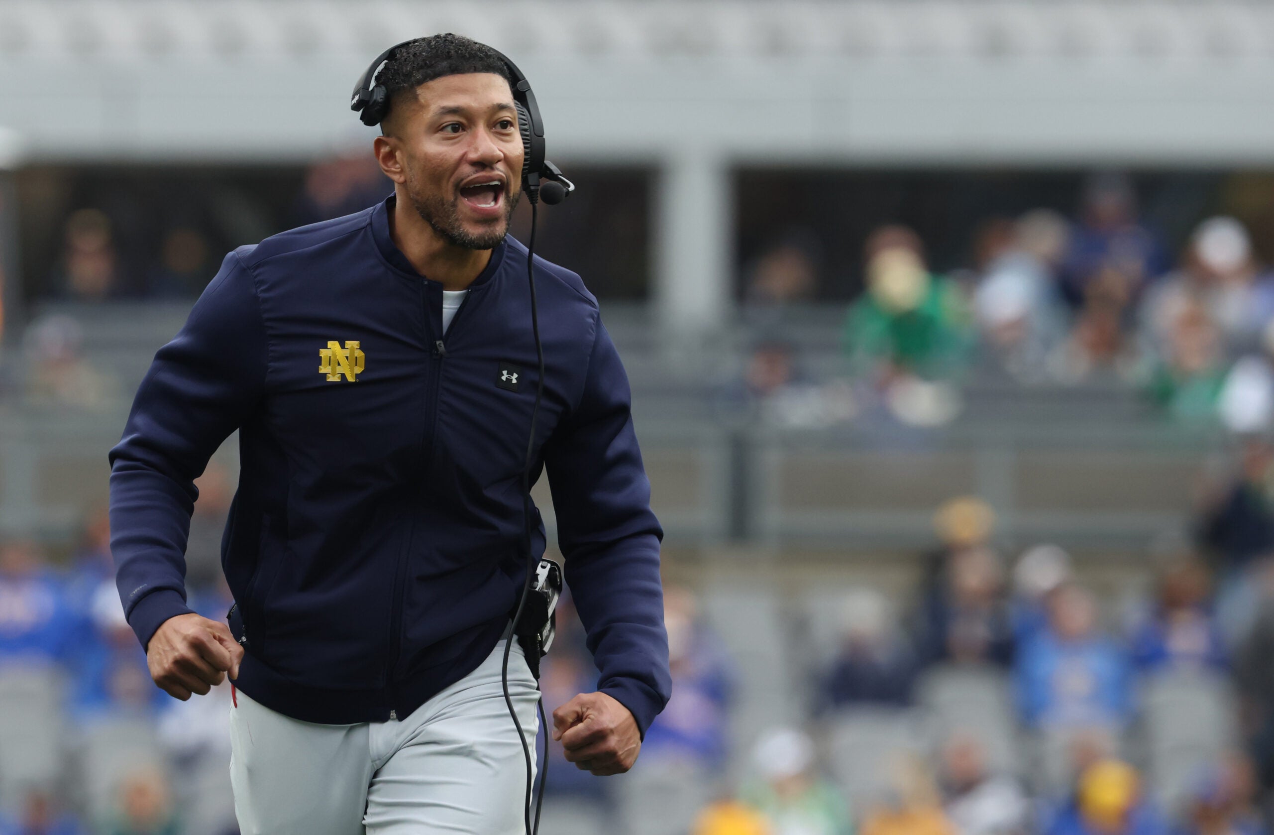 Nov 15, 2025; Pittsburgh, Pennsylvania, USA; Notre Dame Fighting Irish head coach Marcus Freeman reacts after an Irish touchdown against the Pittsburgh Panthers during the second quarter at Acrisure Stadium.