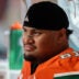 Nov 15, 2025; Miami Gardens, Florida, USA; Miami Hurricanes offensive lineman Francis Mauigoa (61) watches from the bench against NC State Wolfpack during the third quarter at Hard Rock Stadium.