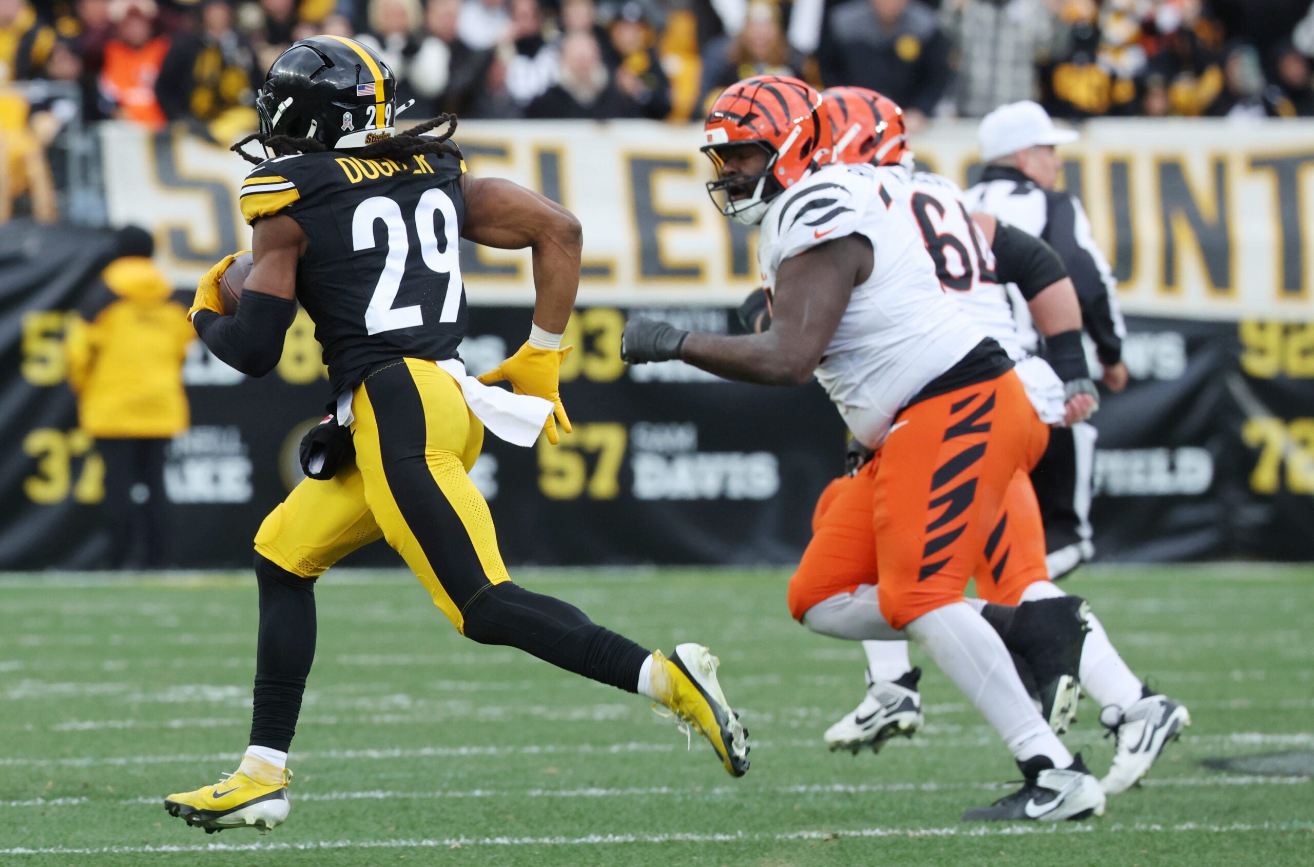 Nov 16, 2025; Pittsburgh, Pennsylvania, USA; Pittsburgh Steelers safety Kyle Dugger (29) intercepts the ball against the Cincinnati Bengals during the second half at Acrisure Stadium.