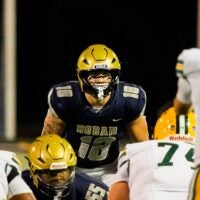 Hoban’s Brayton Feister (18) eyes the St. Edward offensive line, Oct. 24, 2025.