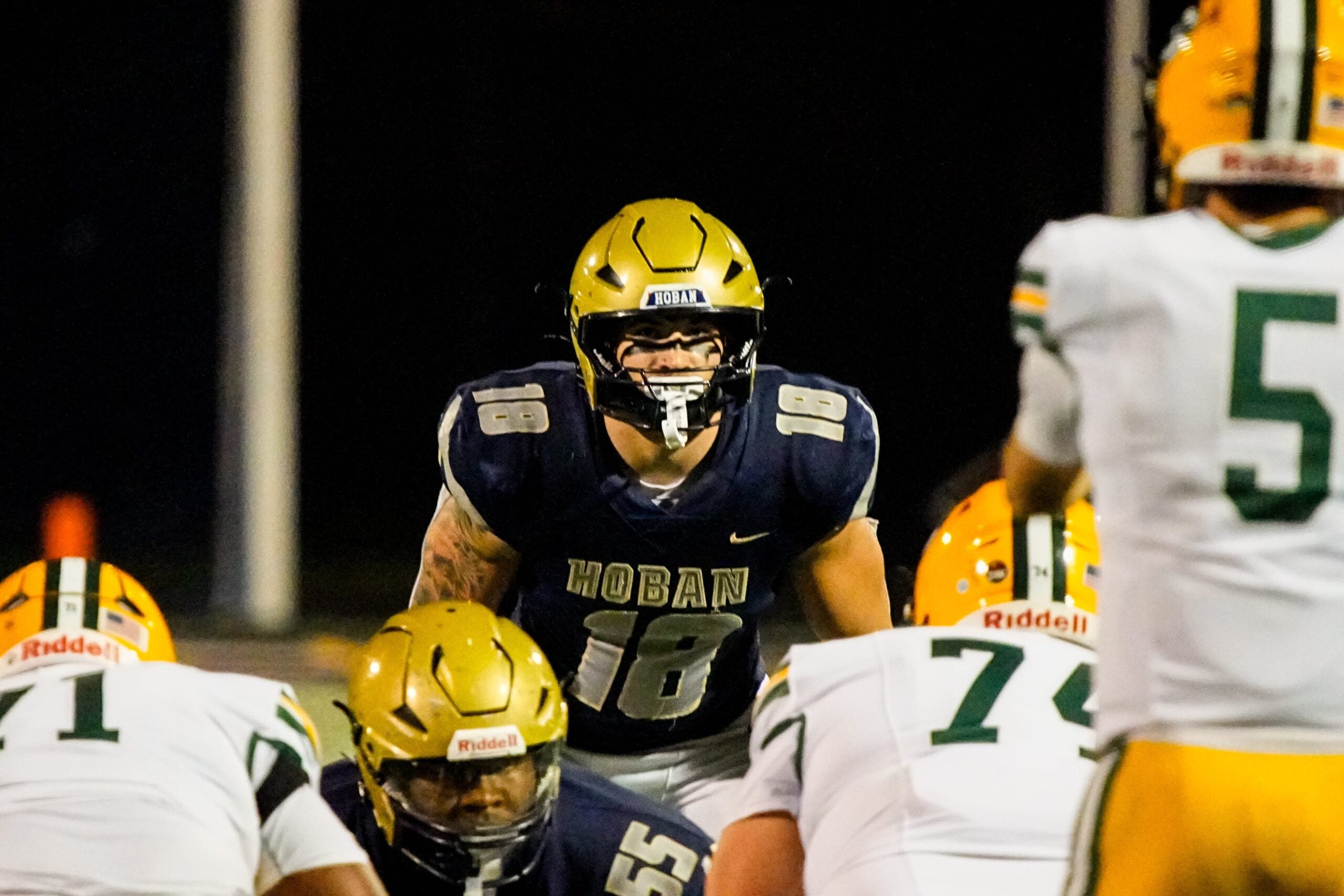Hoban’s Brayton Feister (18) eyes the St. Edward offensive line, Oct. 24, 2025.