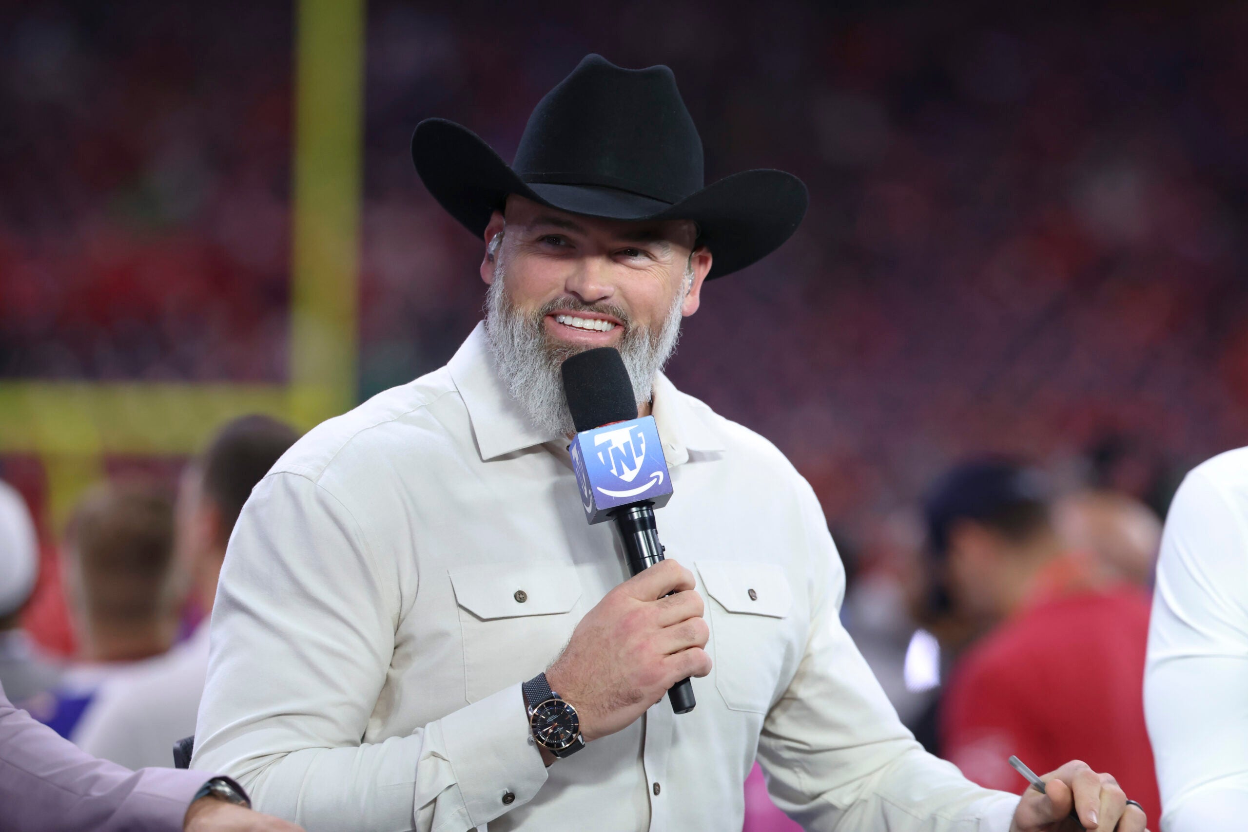 Nov 20, 2025; Houston, Texas, USA; Television analyst Andrew Whitworth talks before the game between the Houston Texans and the Buffalo Bills at NRG Stadium.