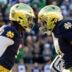 Nov 22, 2025; South Bend, Indiana, USA; Notre Dame Fighting Irish defensive lineman Boubacar Traore, left, and Notre Dame Fighting Irish defensive lineman Jason Onye, right celebrate a stop against the Syracuse Orange during the first half at Notre Dame Stadium.