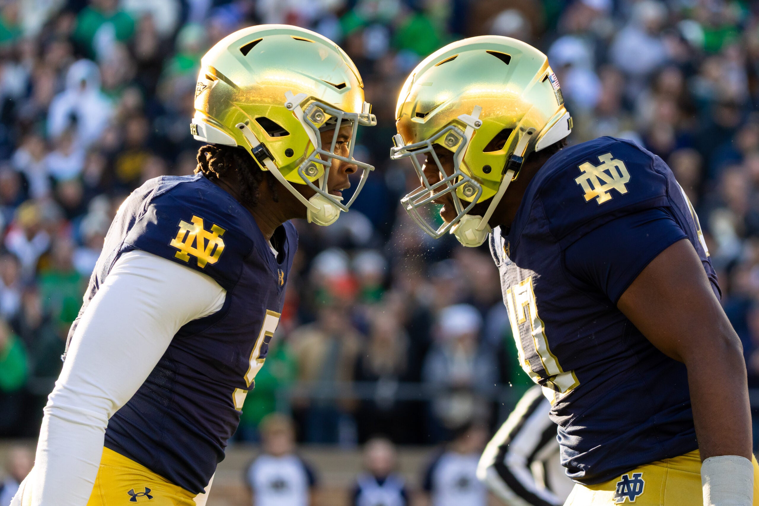 Nov 22, 2025; South Bend, Indiana, USA; Notre Dame Fighting Irish defensive lineman Boubacar Traore, left, and Notre Dame Fighting Irish defensive lineman Jason Onye, right celebrate a stop against the Syracuse Orange during the first half at Notre Dame Stadium.