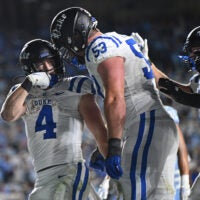 Nov 22, 2025; Chapel Hill, North Carolina, USA; Duke Blue Devils running back Anderson Castle (4) celebrates a touchdown with offensive lineman Brian Parker II (53) during the second half against North Carolina at Kenan Stadium.