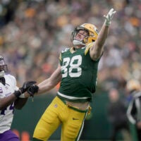 Nov 23, 2025; Green Bay, Wisconsin, USA; Minnesota Vikings safety Joshua Metellus (44) is called for pass interference while covering Green Bay Packers tight end Luke Musgrave (88) during the first quarter of their game at Lambeau Field.
