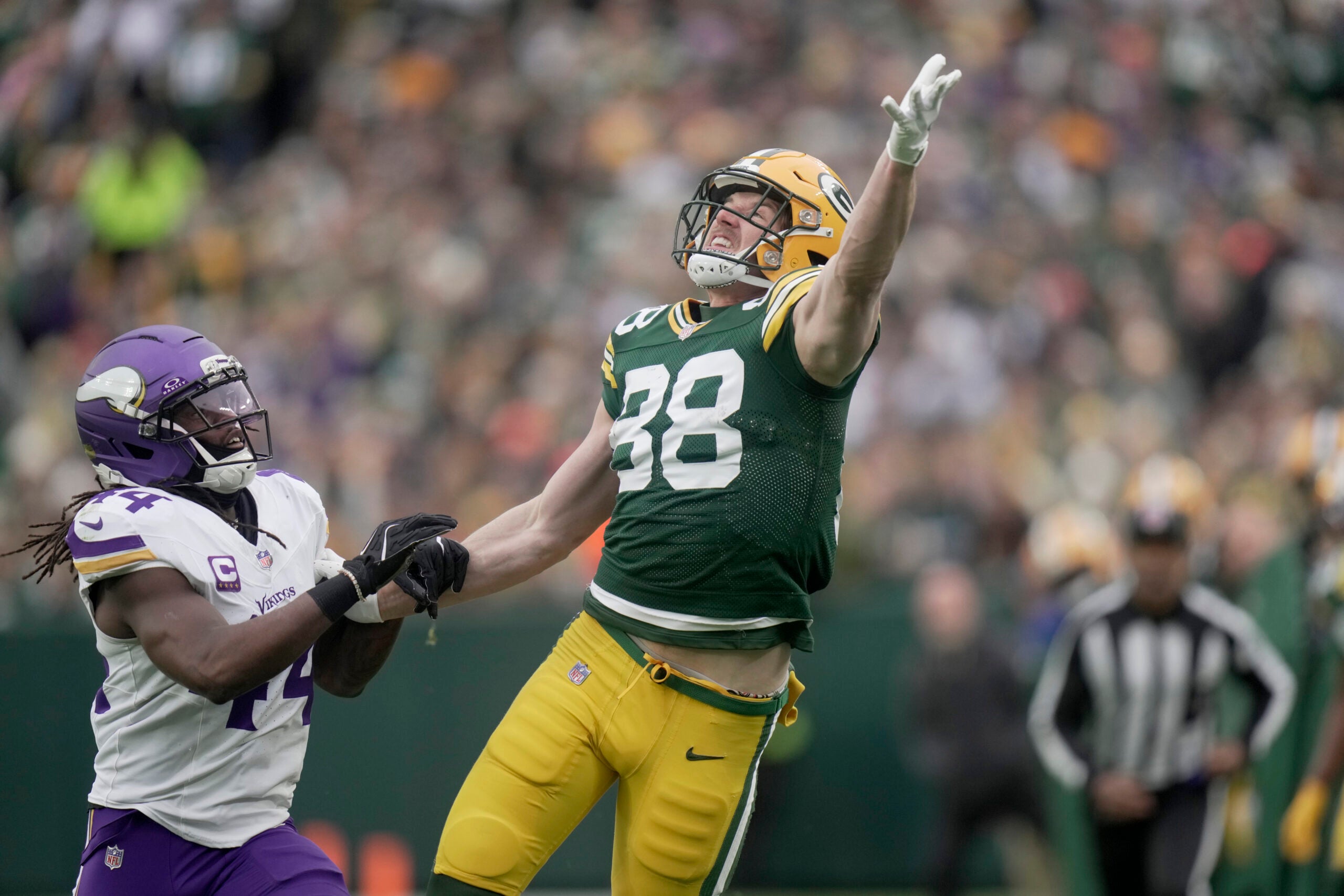 Nov 23, 2025; Green Bay, Wisconsin, USA; Minnesota Vikings safety Joshua Metellus (44) is called for pass interference while covering Green Bay Packers tight end Luke Musgrave (88) during the first quarter of their game at Lambeau Field.