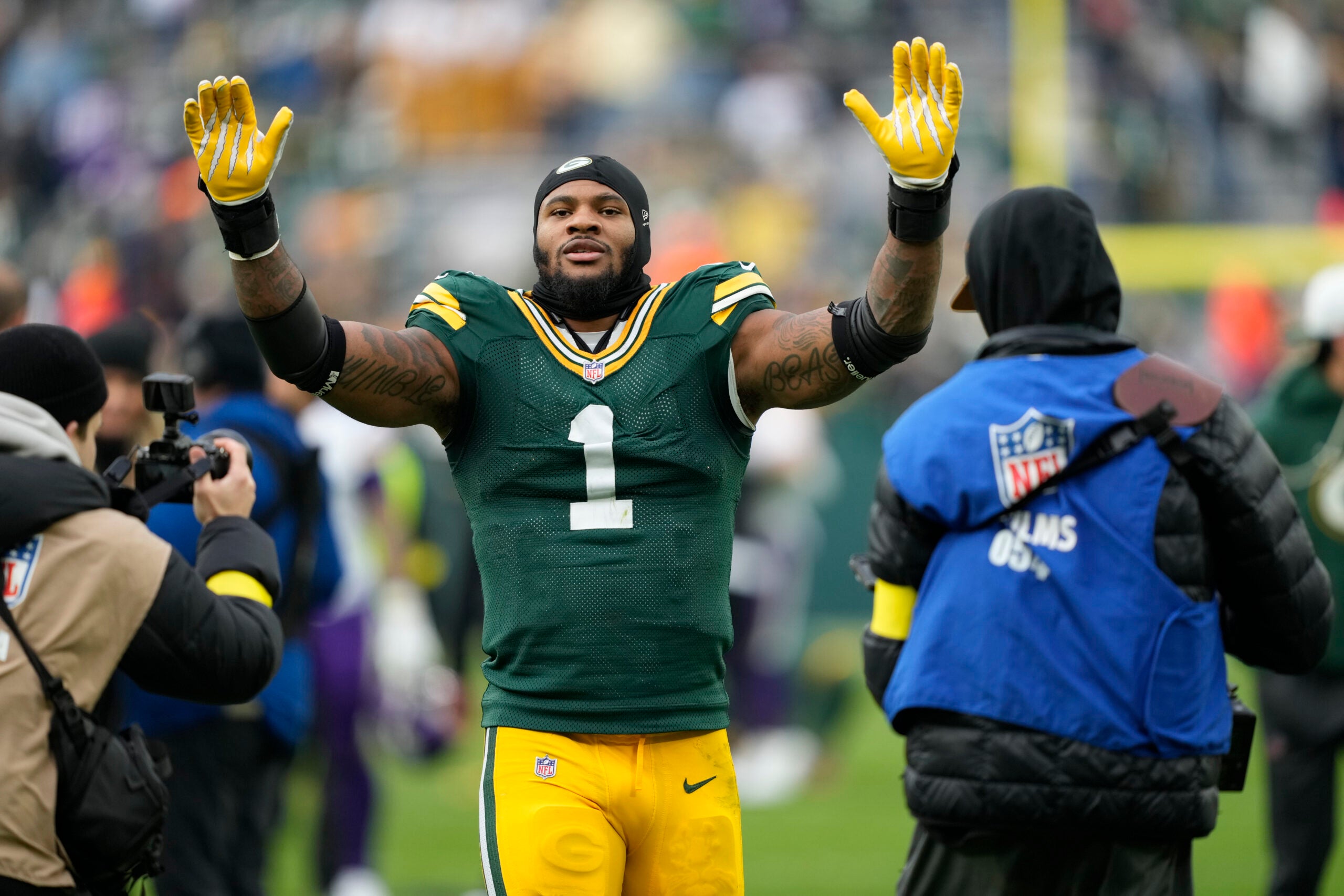Nov 23, 2025; Green Bay, Wisconsin, USA; Green Bay Packers defensive end Micah Parsons (1) celebrates the victory over the Minnesota Vikings at Lambeau Field.