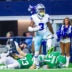 Nov 23, 2025; Arlington, Texas, USA; Dallas Cowboys wide receiver George Pickens (3) reacts after making a catch over Philadelphia Eagles cornerback Cooper DeJean (33) and Philadelphia Eagles safety Sydney Brown (21) during the game at AT&T Stadium.