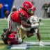 Nov 28, 2025; Atlanta, Georgia, USA; Georgia Tech Yellow Jackets running back Chad Alexander (27) is tackled by Georgia Bulldogs defensive lineman Christen Miller (52) and safety Zion Branch (2) during the second half at Mercedes-Benz Stadium.