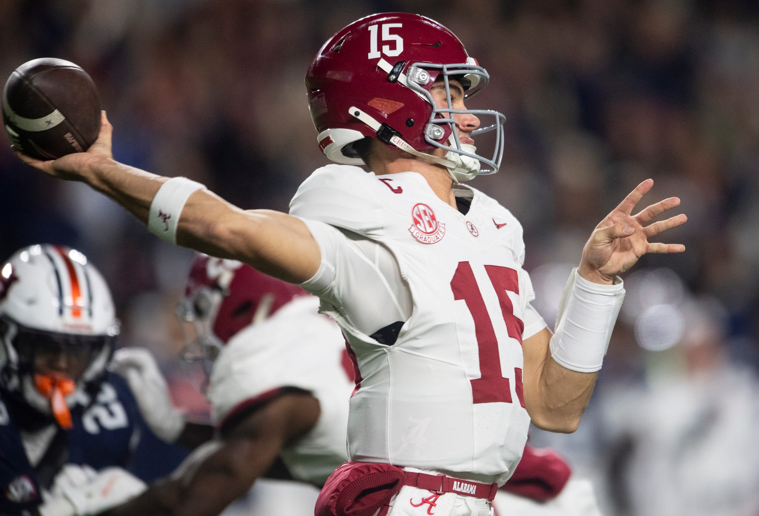 Alabama Crimson Tide quarterback Ty Simpson (15) throws the ball as Auburn Tigers take on Alabama Crimson Tide in the Iron Bowl at Jordan-Hare Stadium in Auburn, Ala. on Saturday, Nov. 29, 2025.