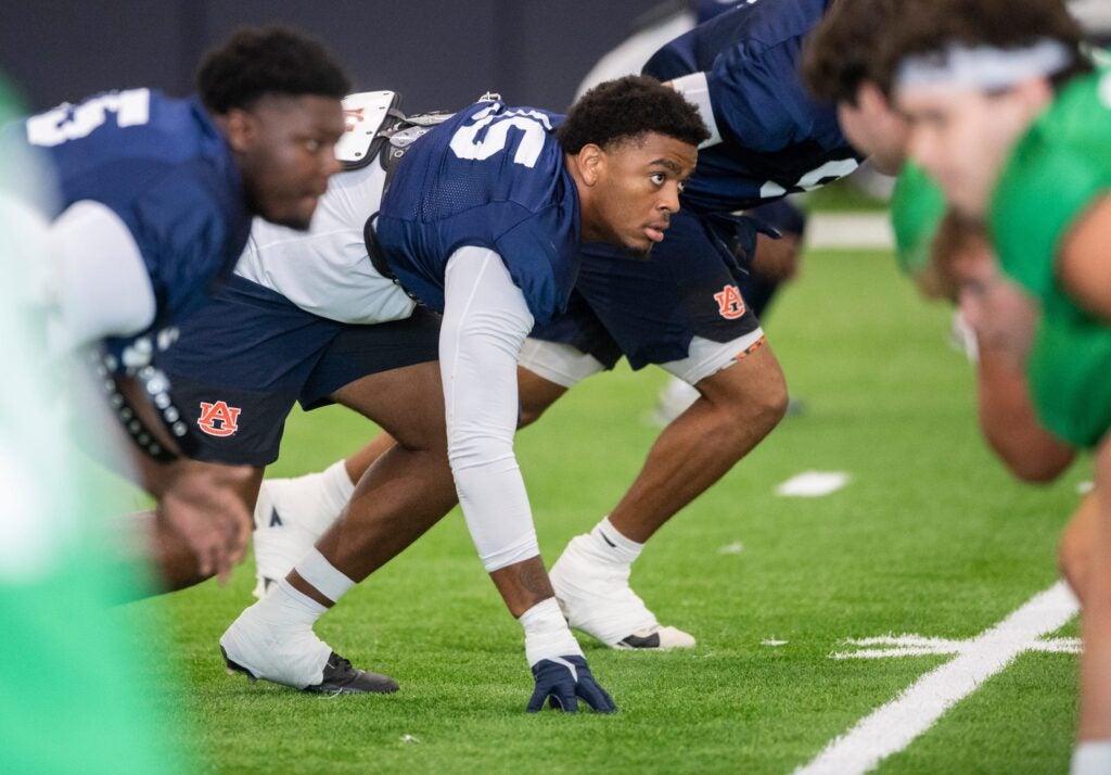 Auburn Tigers defensive end Keldric Faulk (15) runs drills during practice at Woltosz Football Performance Center in Auburn, Ala. on Tuesday, Aug. 26, 2025.