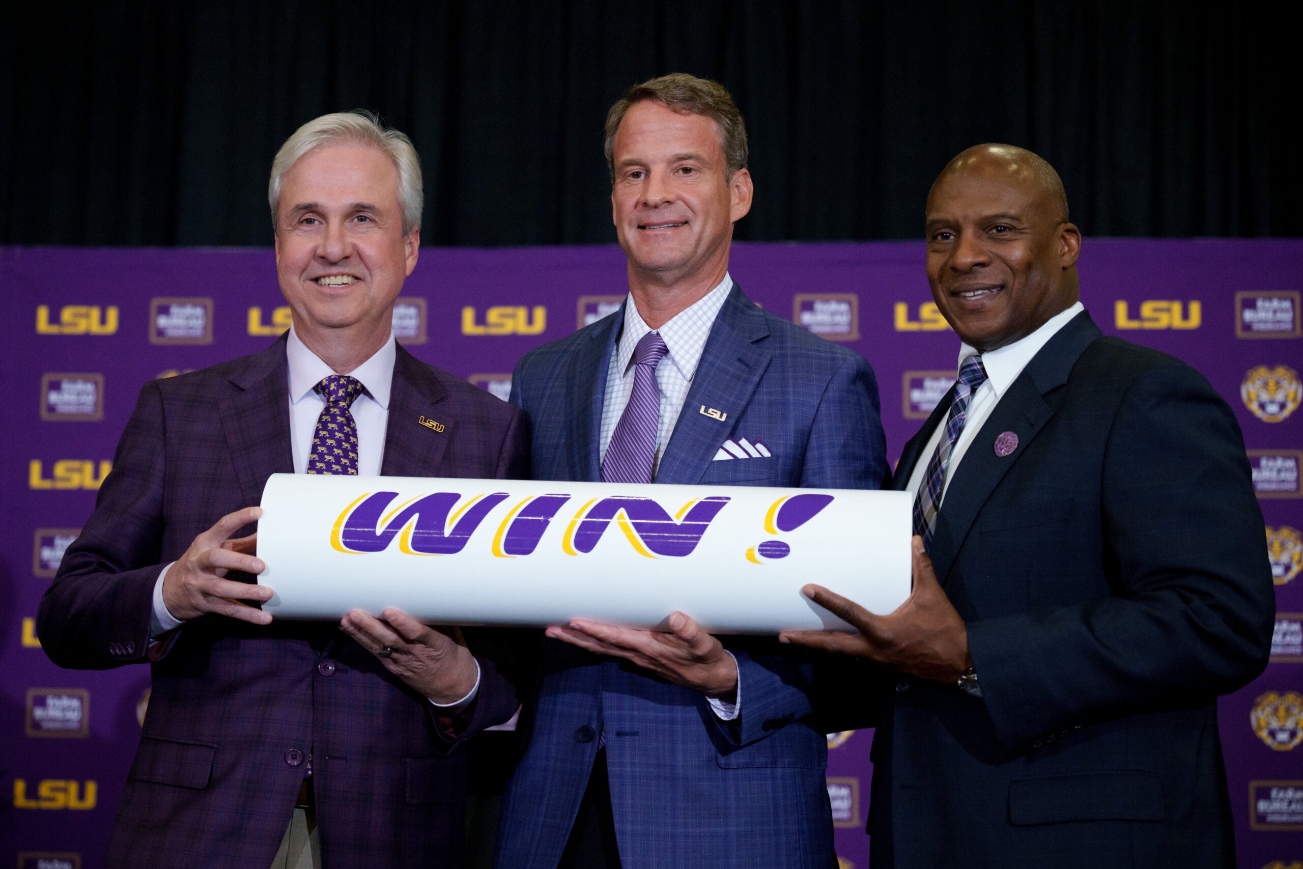 Dec 1, 2025; Baton Rouge, LA, USA; LSU president Wade Rousse, left, LSU new head coach Lane Kiffin and LSU athletic director Verge Ausberry stand together at South Stadium Club at Tiger Stadium.