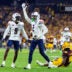 Nov 28, 2025; Tempe, Arizona, USA; Arizona Wildcats defensive back Treydan Stukes (2) celebrates with defensive back Ayden Garnes (9) after an interception against Arizona State Sun Devils in the second half during the 99th Territorial Cup at Mountain America Stadium.