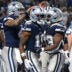Dec 4, 2025; Detroit, Michigan, USA; Dallas Cowboys running back Javonte Williams (33) celebrates with quarterback Dak Prescott (4) and wide receiver Ryan Flournoy (19) after scoring a touchdown during the second half against the Detroit Lions at Ford Field.