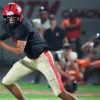 Mooney quarterback Davin Davidson (#4) scrambles as he looks for an open receiver. Cardinal Mooney Catholic High School hosted Cocoa High School for the Class 2A state semi-final football game Friday evening, Dec. 5, 2025. Mooney won the game 40-0.