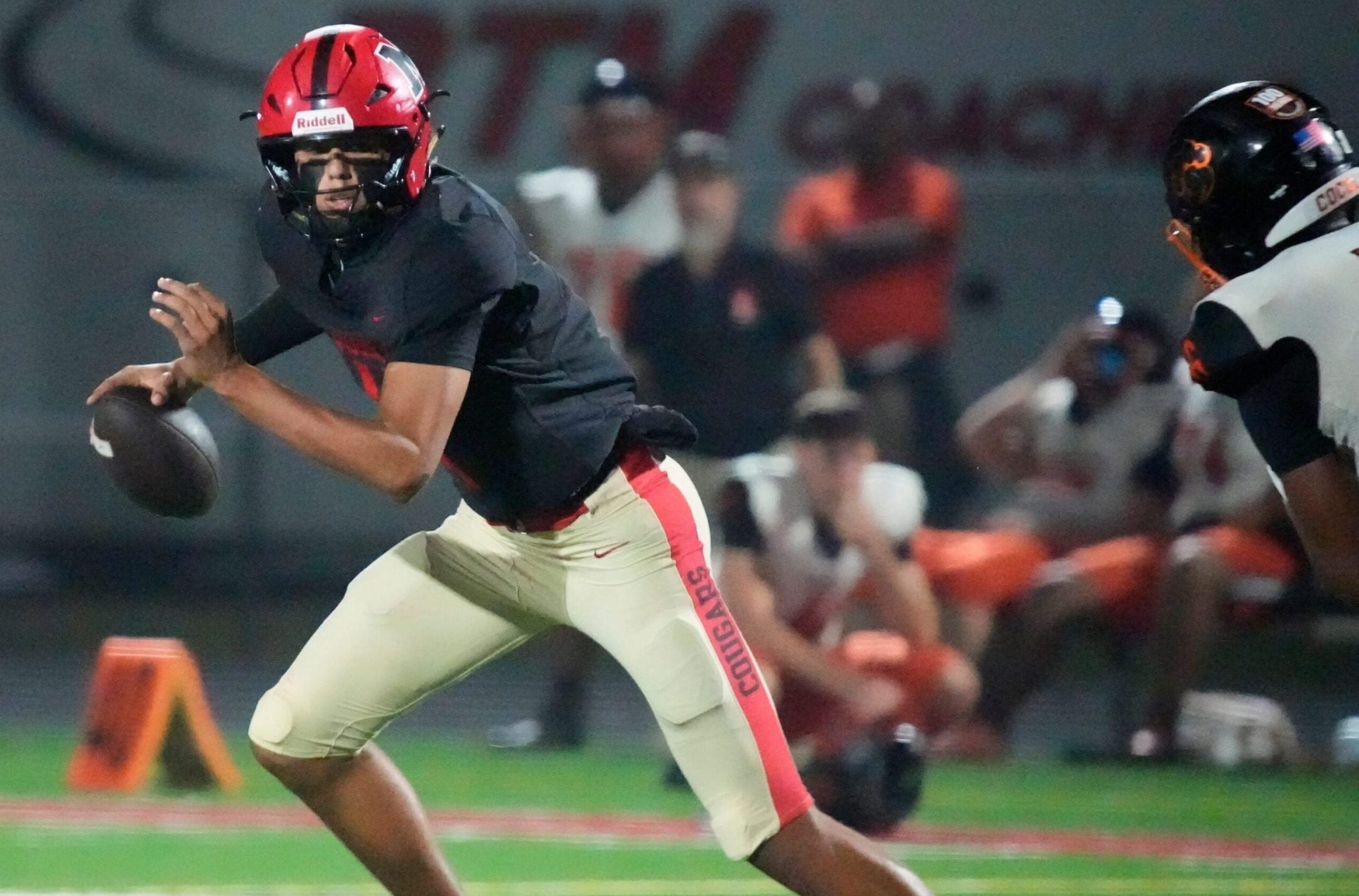 Mooney quarterback Davin Davidson (#4) scrambles as he looks for an open receiver. Cardinal Mooney Catholic High School hosted Cocoa High School for the Class 2A state semi-final football game Friday evening, Dec. 5, 2025. Mooney won the game 40-0.