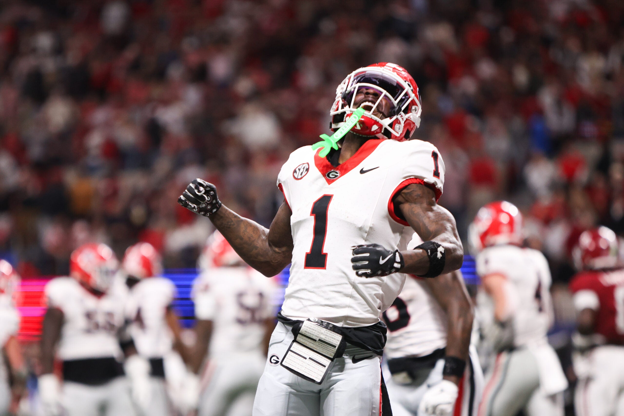 Dec 6, 2025; Atlanta, GA, USA; Georgia Bulldogs wide receiver Zachariah Branch (1) celebrates after scoring a touchdown during the fourth quarter against the Alabama Crimson Tide during the 2025 SEC Championship game at Mercedes-Benz Stadium.