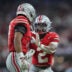 Dec 6, 2025; Indianapolis, IN, USA; Ohio State Buckeyes safety Caleb Downs (2) and cornerback Lorenzo Styles Jr. (3) react in the first half against the Indiana Hoosiers during the 2025 Big Ten championship game at Lucas Oil Stadium.
