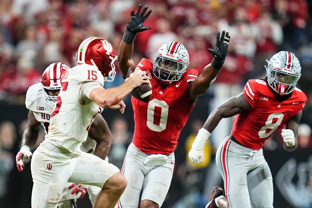 Ohio State Buckeyes linebacker Sonny Styles (0) pressures Indiana Hoosiers quarterback Fernando Mendoza (15) during the Big Ten Conference championship game at Lucas Oil Stadium in Indianapolis on Dec. 6, 2025. Ohio State lost 13-10.