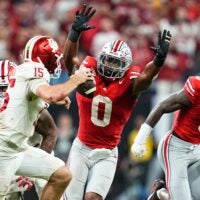 Ohio State Buckeyes linebacker Sonny Styles (0) pressures Indiana Hoosiers quarterback Fernando Mendoza (15) during the Big Ten Conference championship game at Lucas Oil Stadium in Indianapolis on Dec. 6, 2025. Ohio State lost 13-10.