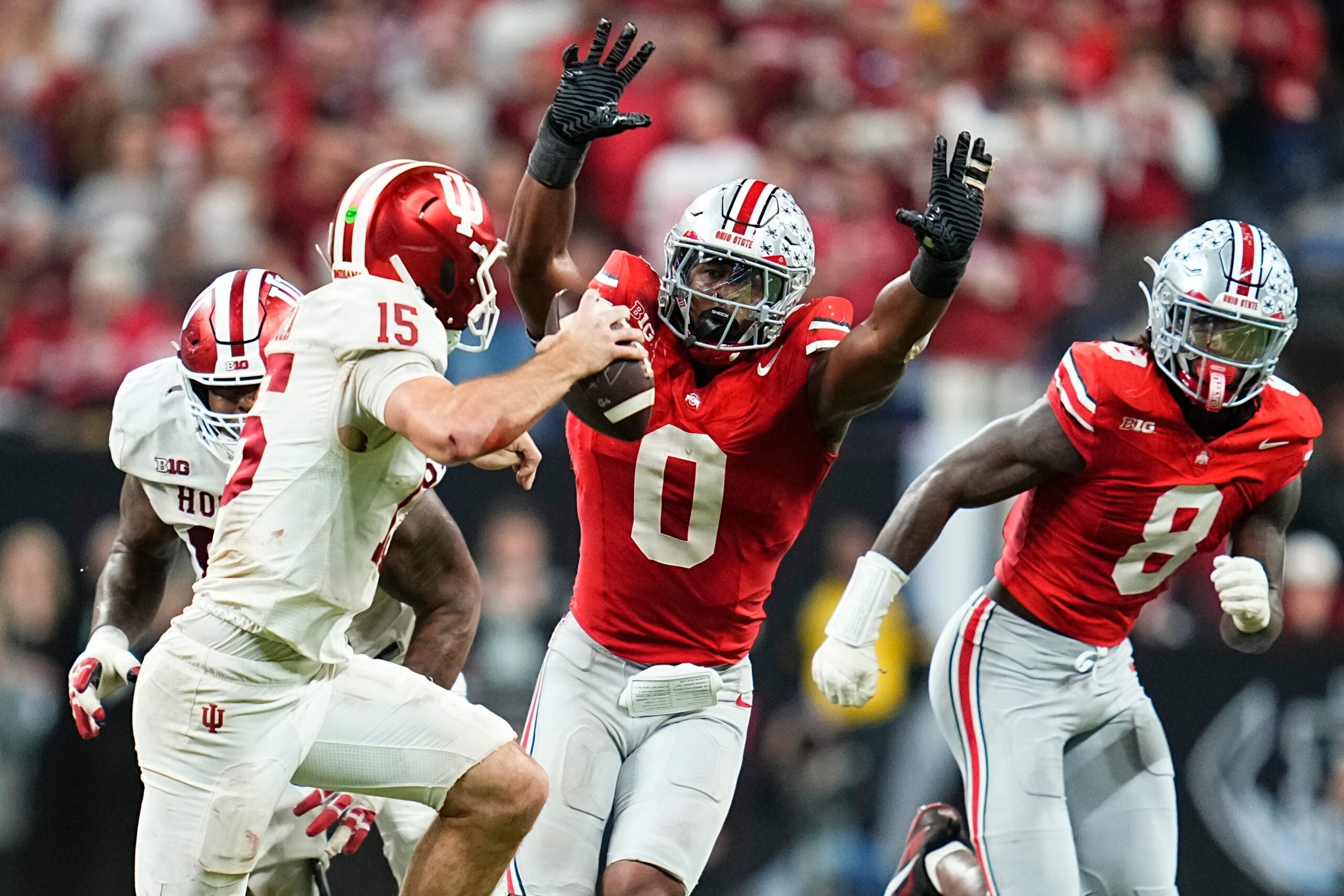 Ohio State Buckeyes linebacker Sonny Styles (0) pressures Indiana Hoosiers quarterback Fernando Mendoza (15) during the Big Ten Conference championship game at Lucas Oil Stadium in Indianapolis on Dec. 6, 2025. Ohio State lost 13-10.