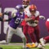 Dec 7, 2025; Minneapolis, Minnesota, USA; Washington Commanders running back Chris Rodriguez Jr. (36) rushes the ball against Minnesota Vikings linebacker Jonathan Greenard (58) during the first half at U.S. Bank Stadium.