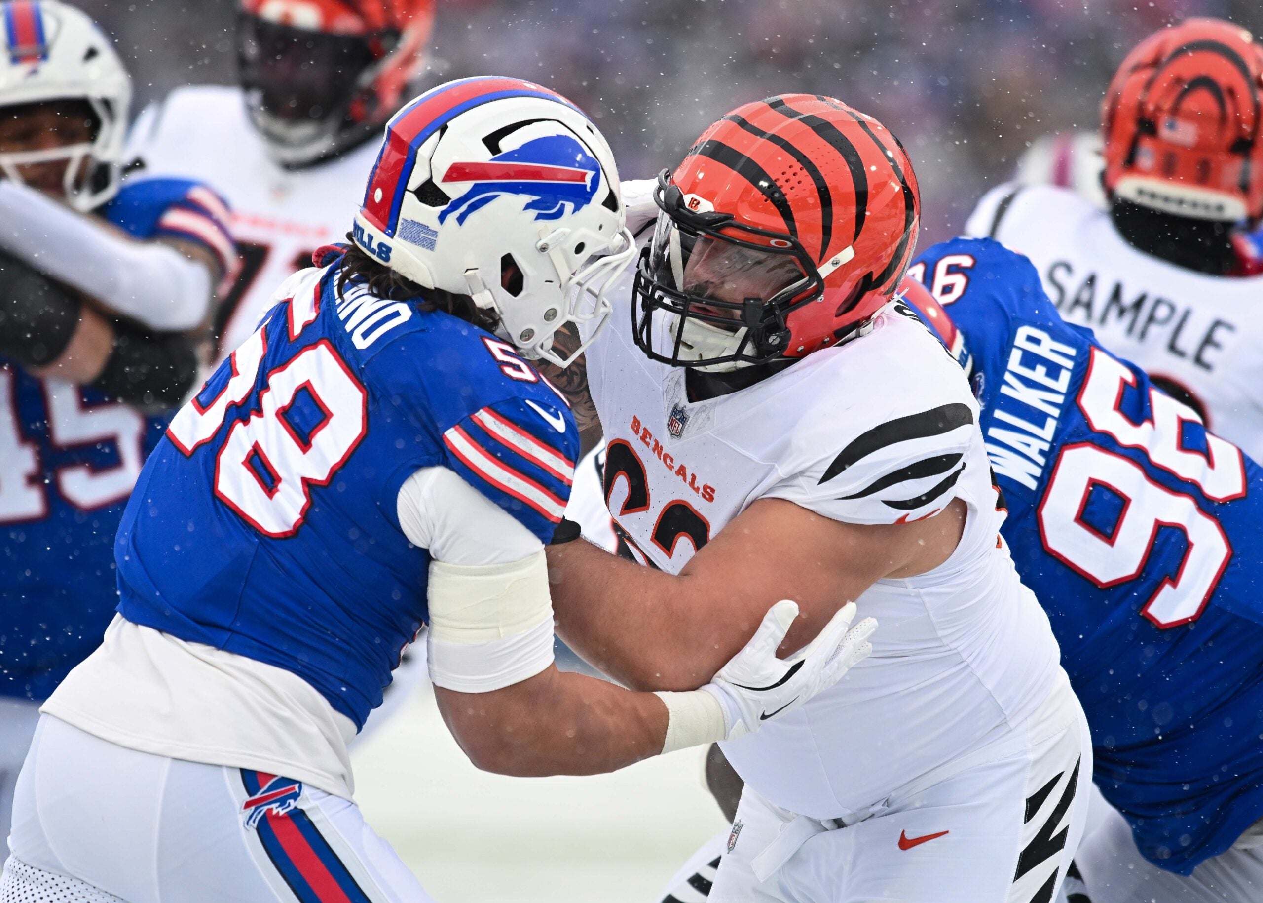 Dec 7, 2025; Orchard Park, New York, USA; Cincinnati Bengals guard Dylan Fairchild (63) blocks Buffalo Bills linebacker Matt Milano (58) in the first quarter at Highmark Stadium.
