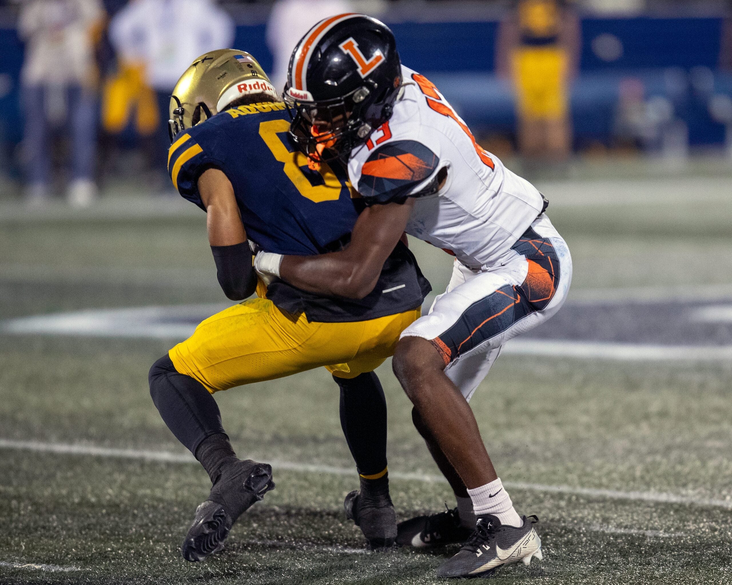Lakeland's Jordan Young tackles St. Thomas Aquinas' Julius Jones on Thursday night at Pitbull Stadium in the 2025 FHSAA Class 5A State Football Finals.