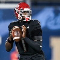 Champ Monds (1) of Vero Beach looks to pass in the FHSAA Class 7A state championship, Dec. 13, 2025, at Pitbull Stadium in Miami.
