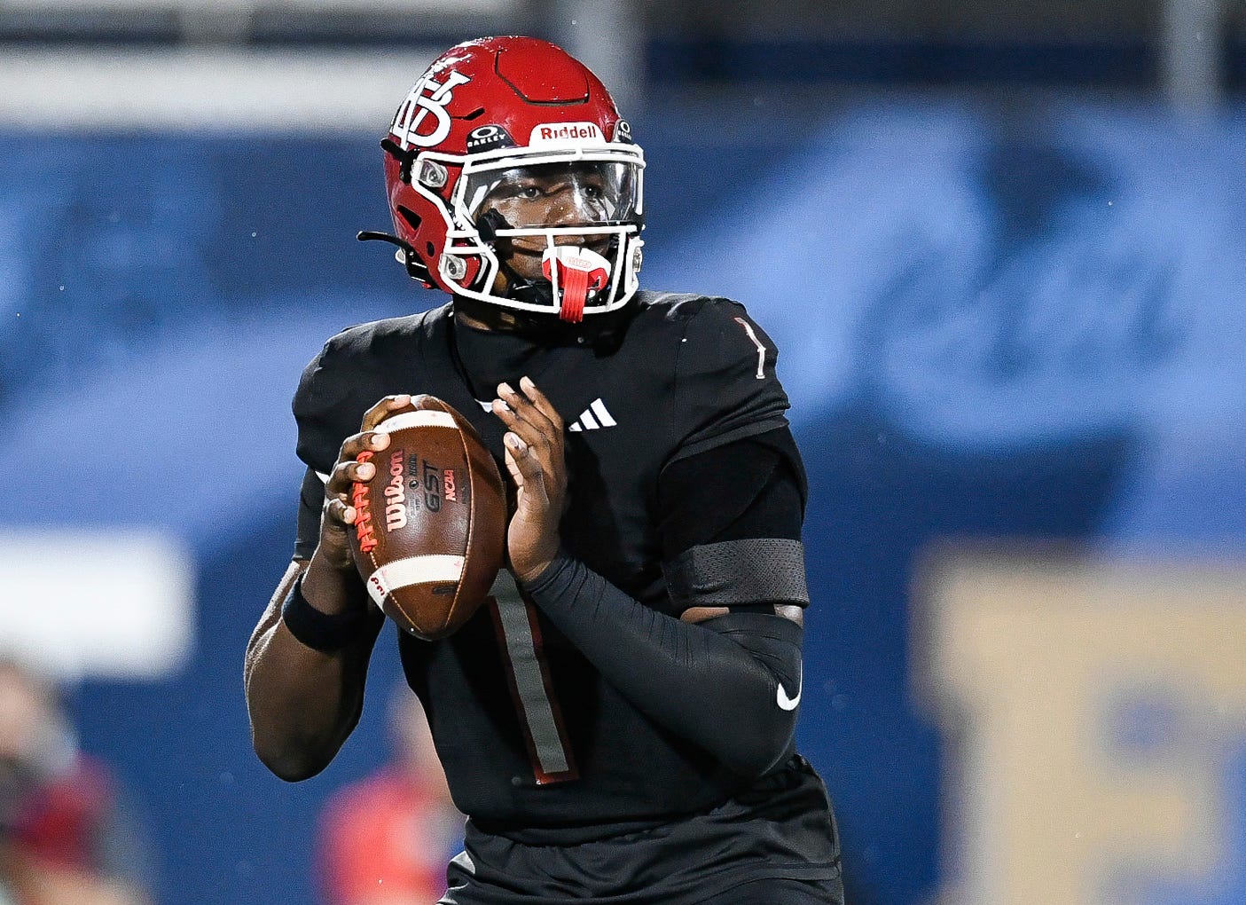 Champ Monds (1) of Vero Beach looks to pass in the FHSAA Class 7A state championship, Dec. 13, 2025, at Pitbull Stadium in Miami.