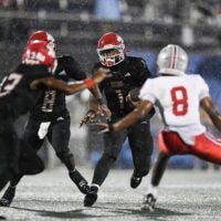 Champ Monds (1) of Vero Beach looks for an opening in the FHSAA Class 7A state championship, Dec. 13, 2025, at Pitbull Stadium in Miami. Lake Mary won 28-27.