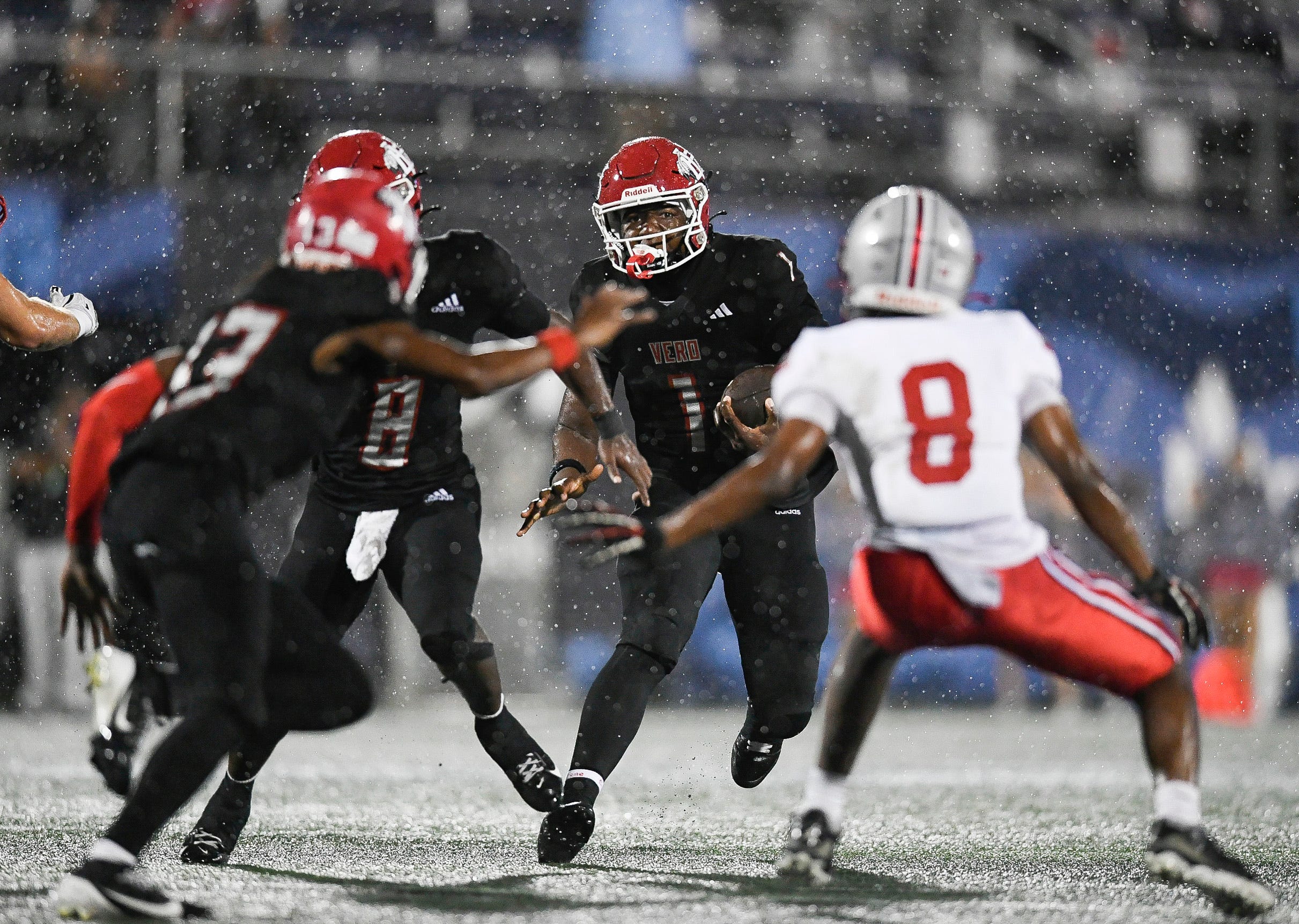 Champ Monds (1) of Vero Beach looks for an opening in the FHSAA Class 7A state championship, Dec. 13, 2025, at Pitbull Stadium in Miami. Lake Mary won 28-27.