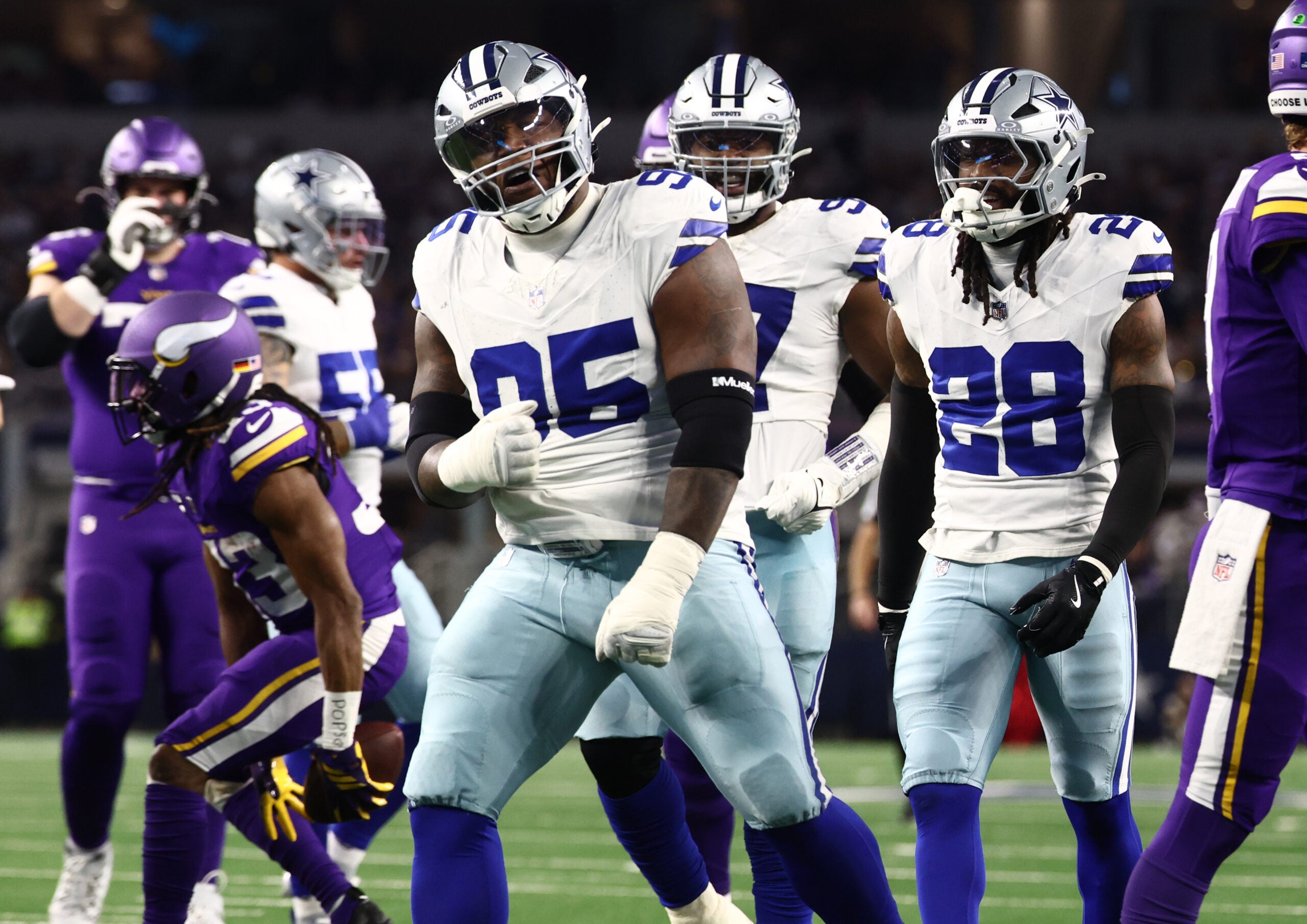 Dec 14, 2025; Arlington, Texas, USA; Dallas Cowboys defensive tackle Kenny Clark (95) celebrates after a play during the first half against the Minnesota Vikings at AT&T Stadium.