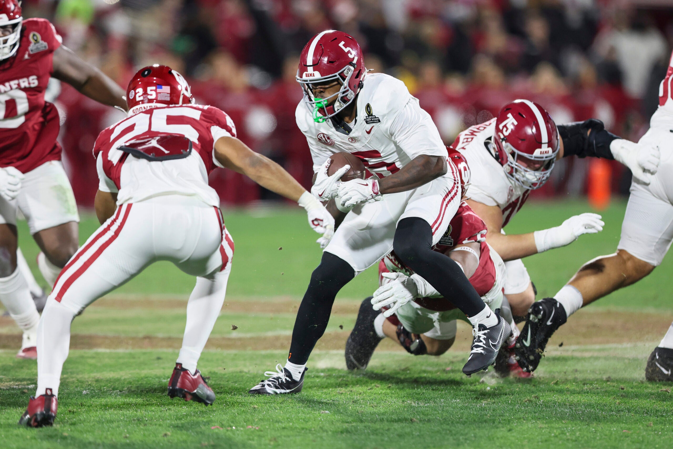 Dec 19, 2025; Norman, OK, USA; Alabama Crimson Tide wide receiver Germie Bernard (5) runs the ball in the second half against the Oklahoma Sooners at Gaylord Family OK Memorial Stadium.