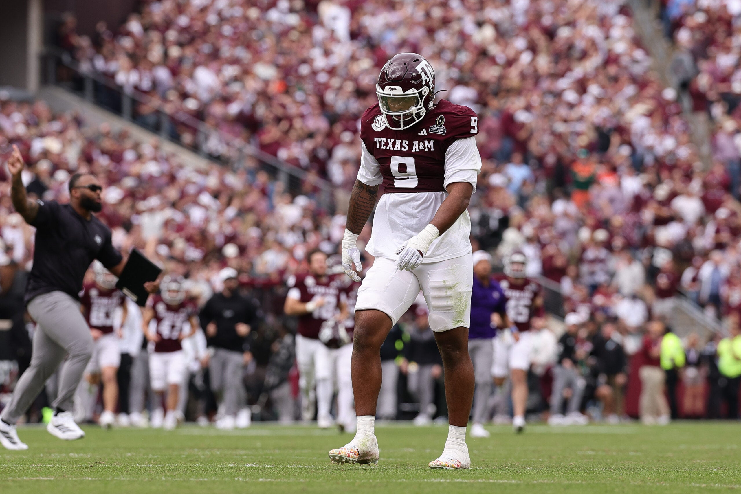 Dec 20, 2025; College Station, TX, USA; Texas A&M Aggies defensive end Cashius Howell (9) reacts during first half of the first round game of the CFP National Playoff against the Miami Hurricanes at Kyle Field.