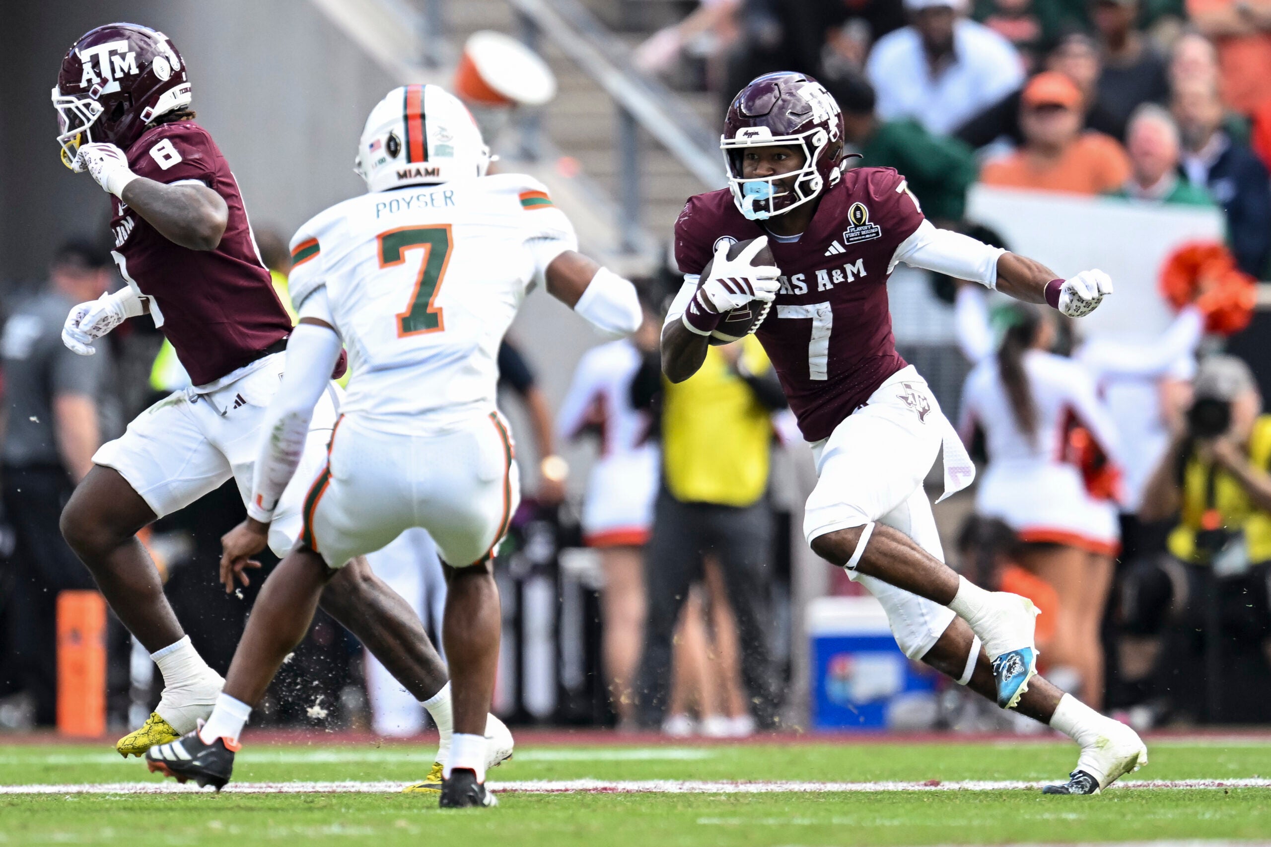 Dec 20, 2025; College Station, TX, USA; Texas A&M Aggies wide receiver KC Concepcion (7) runs the ball against the Miami Hurricanes during the second half at Kyle Field.