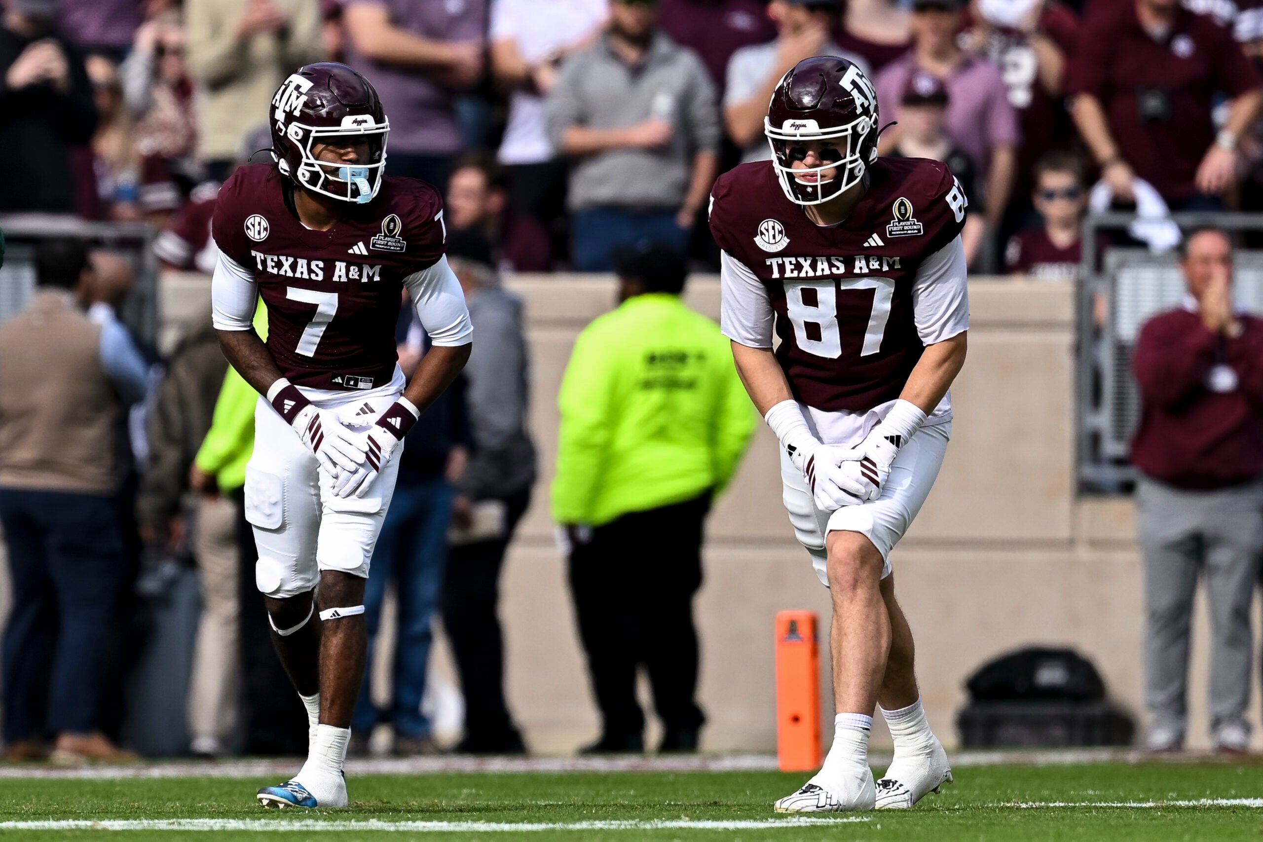 Dec 20, 2025; College Station, TX, USA; Texas A&M Aggies tight end Nate Boerkircher (87) and wide receiver KC Concepcion (7) line up during the first half against the Miami Hurricanes at Kyle Field.