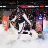 Dec 20, 2025; Chicago, Illinois, USA; Chicago Bears defensive end Montez Sweat (98) runs onto the field during player introductions before the game against the Green Bay Packers at Soldier Field.