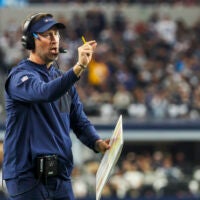 Dec 21, 2025; Arlington, Texas, USA; Dallas Cowboys head coach Brian Schottenheimer reacts to a play against the Los Angeles Chargers during the second quarter at AT&T Stadium.
