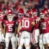 Dec 19, 2025; Norman, OK, USA; Oklahoma Sooners quarterback John Mateer (10) in the huddle with wide receiver Javonnie Gibson (11), Isaiah Sategna III (5) and tight end Jaren Kanak (12) against the Alabama Crimson Tide during the CFP National Playoff First Round at Gaylord Family Oklahoma Memorial Stadium.