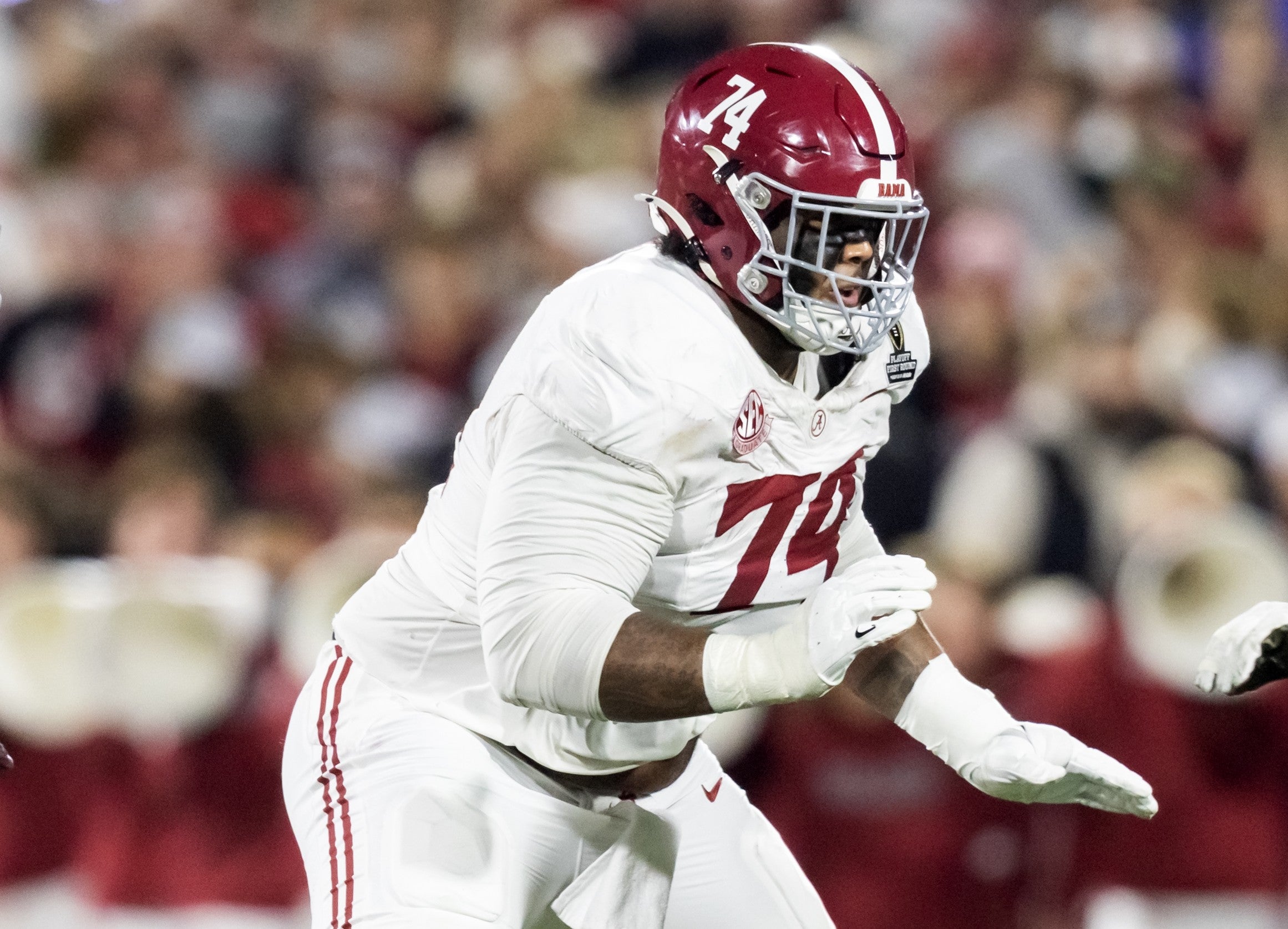 Dec 19, 2025; Norman, OK, USA; Alabama Crimson Tide offensive lineman Kadyn Proctor (74) against the Oklahoma Sooners during the CFP National Playoff First Round at Gaylord Family Oklahoma Memorial Stadium.