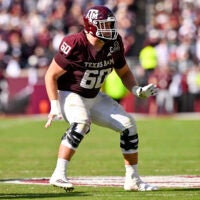 Dec 20, 2025; College Station, TX, USA; Texas A&M Aggies offensive lineman Trey Zuhn III (60) blocks the rush during the game between the Aggies and the Hurricanes at Kyle Field.