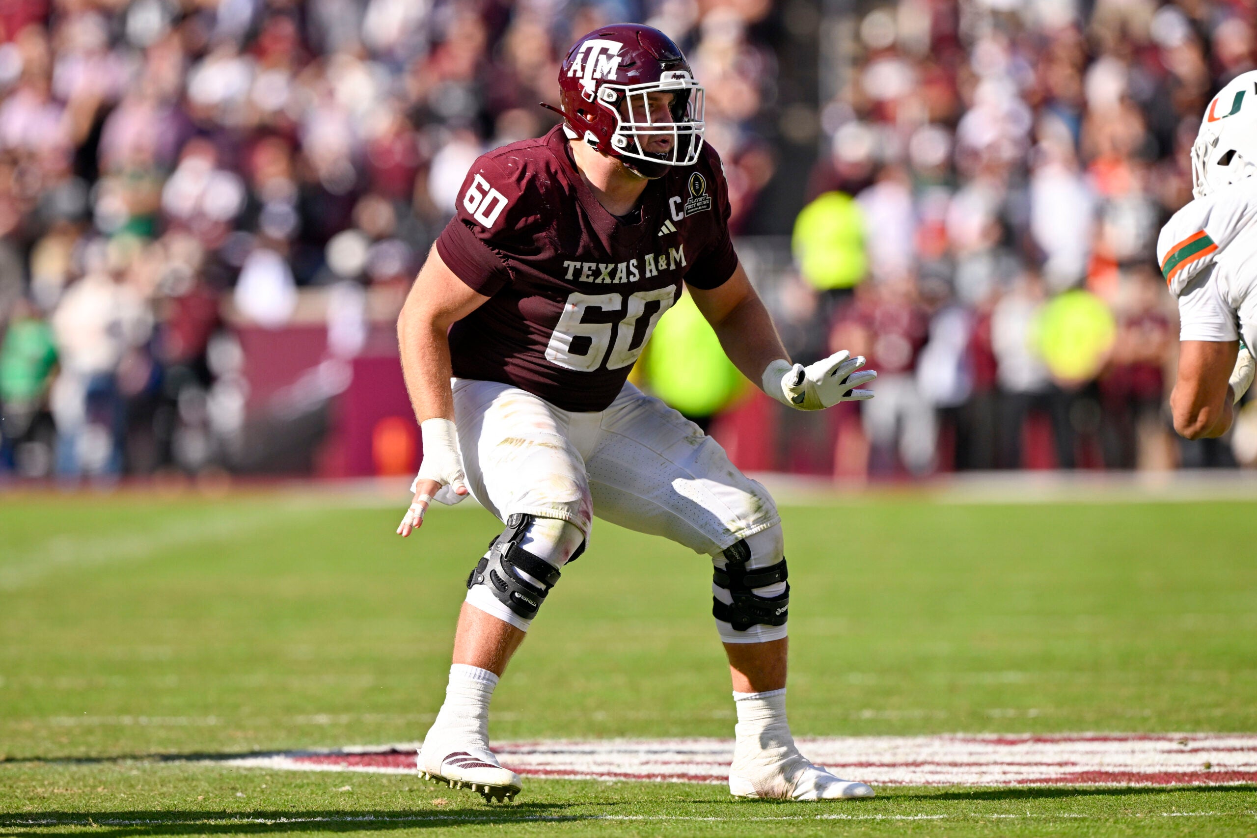 Dec 20, 2025; College Station, TX, USA; Texas A&M Aggies offensive lineman Trey Zuhn III (60) blocks the rush during the game between the Aggies and the Hurricanes at Kyle Field.