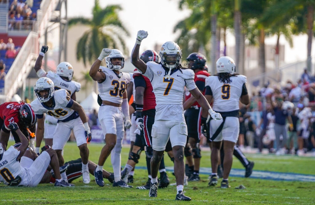 Dec 23, 2025; Boca Raton, FL, USA; Toledo Rockets safety Emmanuel McNeil-Warren (7) celebrates a third down stop against the Louisville Cardinals during the third quarter of the Boca Raton Bowl at Flagler CU Stadium.
