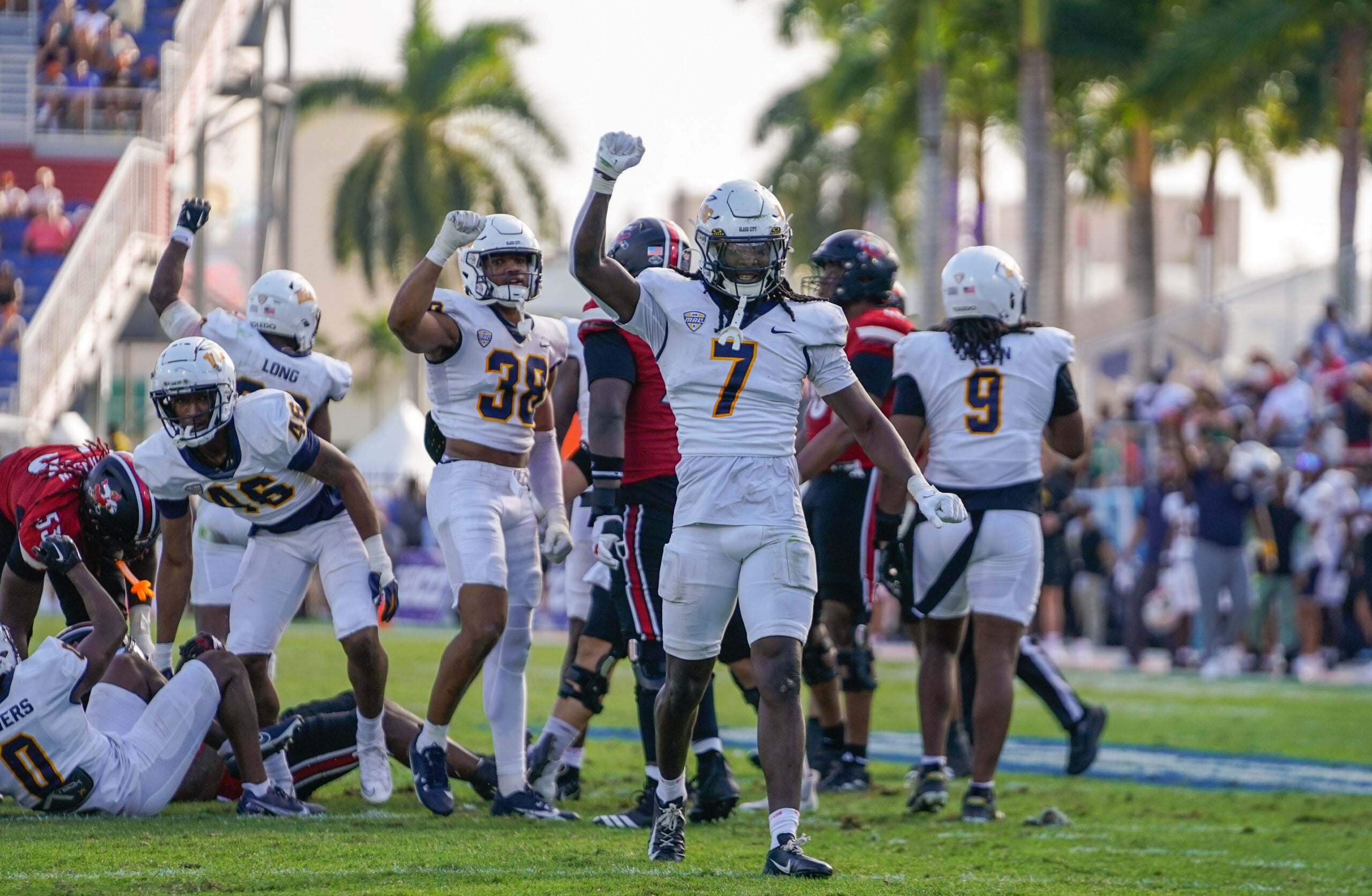 Dec 23, 2025; Boca Raton, FL, USA; Toledo Rockets safety Emmanuel McNeil-Warren (7) celebrates a third down stop against the Louisville Cardinals during the third quarter of the Boca Raton Bowl at Flagler CU Stadium.