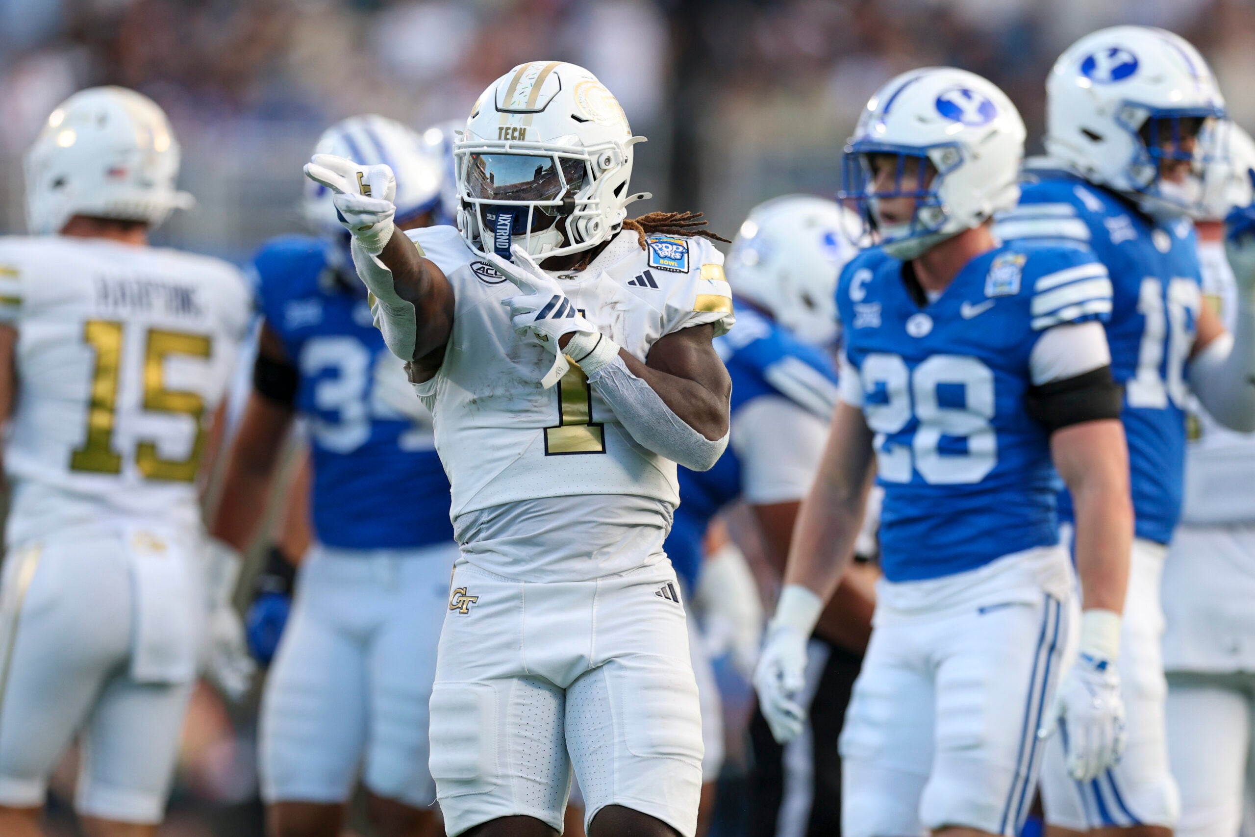 Dec 27, 2025; Orlando, FL, USA; Georgia Tech Yellow Jackets running back Jamal Haynes (1) reacts after a first down against the BYU Cougars in the second quarter during the Pop-Tarts Bowl at Camping World Stadium.