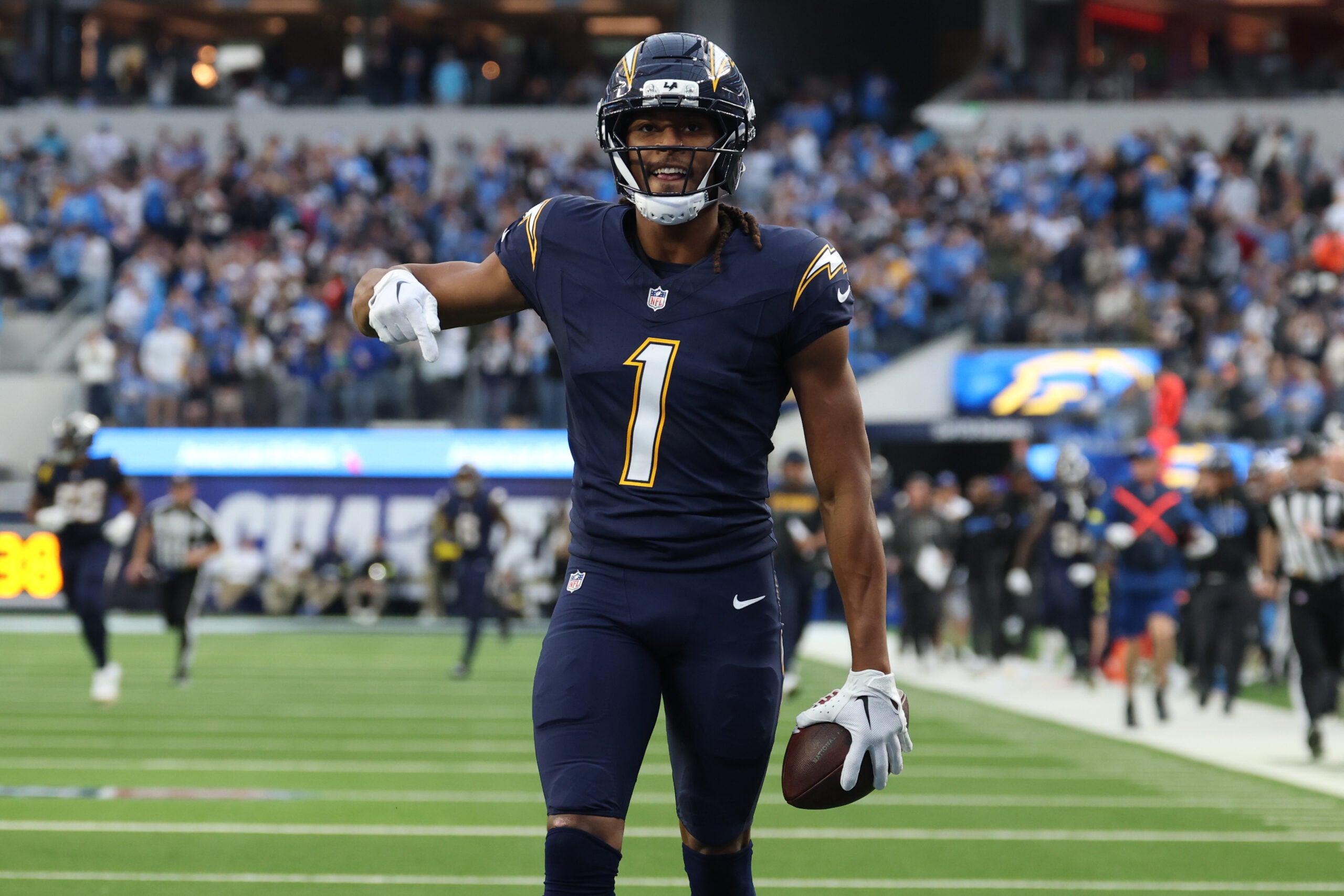 Dec 27, 2025; Inglewood, California, USA; Los Angeles Chargers wide receiver Quentin Johnston (1) reacts after making a 60-yard reception against the Houston Texans during the first half at SoFi Stadium.