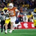 Dec 31, 2025; Orlando, FL, USA; Texas Longhorns quarterback Arch Manning (16) rushes with the ball for a touchdown against the Michigan Wolverines during the second half at Camping World Stadium.