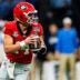 Georgia quarterback Gunner Stockton (14) rolls out of the pocket during the Sugar Bowl and College Football Playoff quarterfinals at Caesars Superdome in New Orleans, La., on Thursday, Jan. 1, 2026. Ole Miss defeated Georgia 39-34.